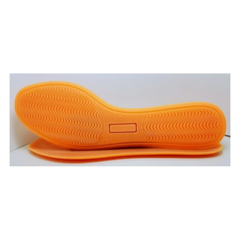 Orange boxing outsole with continuous micro-textured tread and curved side profile