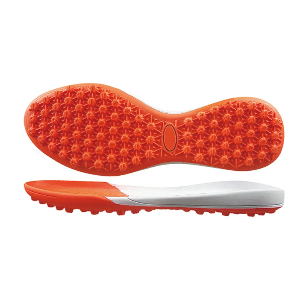 Orange turf soccer outsole with dense rounded low-profile lugs and white layered sole