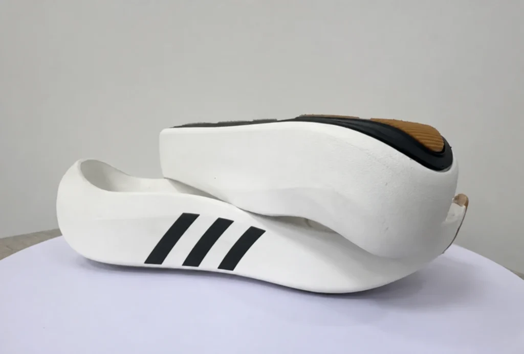 EVA and rubber sports shoe sole construction for cushioning and durability