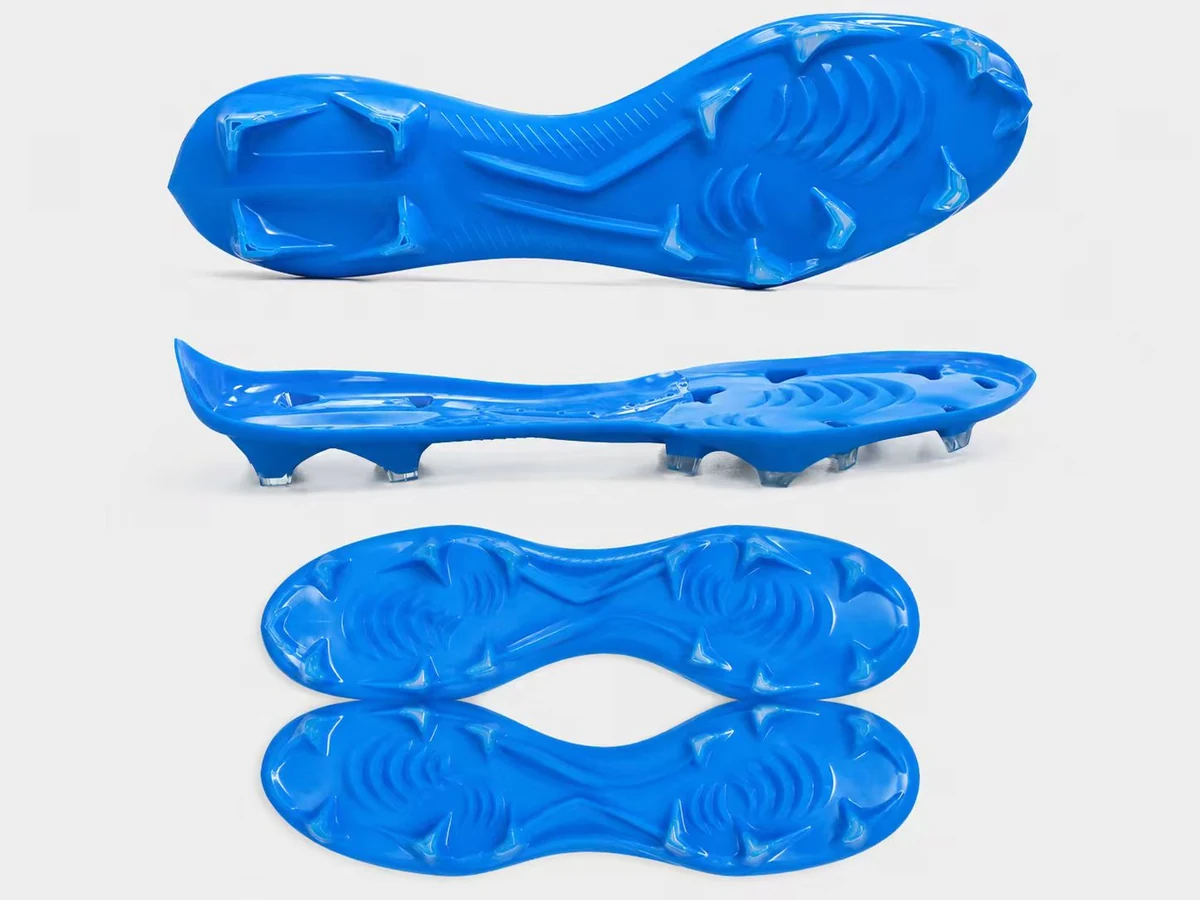 Existing blue TPU fixed-stud soccer outsole for natural grass shown from multiple angles